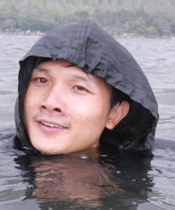 Swimming in hiking poncho